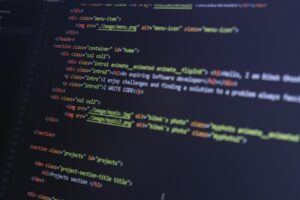 HTML and CSS code on a computer monitor, highlighting web development and programming.